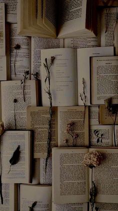 many open books with flowers on them are arranged in the shape of a wallpaper