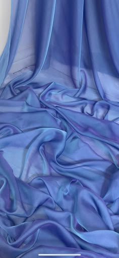 an image of a blue cloth that is very soft and drapeed with it