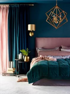 a bedroom with blue walls, gold accents and green velvet bedding in the foreground