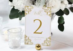 the table numbers are gold and white