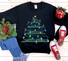 If you're a book lover, this is the shirt for you! This christmas gift features a festive tree with books sticking out of it. The shirt is made from soft and comfortable fabric, perfect for wearing all day long. It's also a great way to show your support for the library community during the holiday season. So whether you're looking for a unique Christmas gift or just want to add some extra warmth to your wardrobe, consider purchasing this shirt today. * S I Z I N G * ✺ Sizing is unisex  ✺ For adults, size runs like men's, though not overly large. Most women find their typical size works best, since they are meant to fit a touch loose and go up 1 or 2 sizes if you want the oversized look. ✺ Size guide and fit:  The size chart is listed in photos above.  Please use the measurement for the mo Little Sister Gifts, Book Tree, Tree Sweater, Teacher Librarian, Book Shirt, Christmas Book, Make Her Smile, Book Shirts, Aunt Gifts