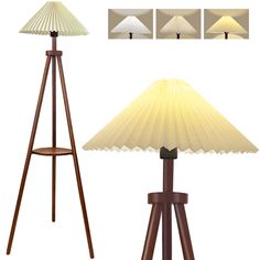 a lamp that is sitting on top of a wooden tripod stand with three different shades