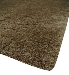 an area rug is shown in brown and beige colors, with no pattern on it