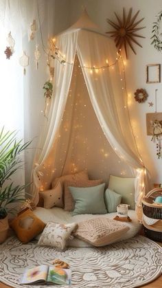 a bedroom with a canopy bed and lots of lights on the ceiling, along with plants