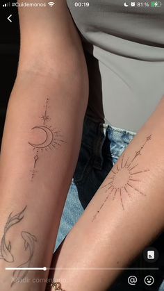 two people with tattoos on their arms and legs, one is holding the other's arm