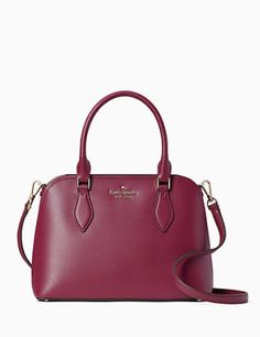 7.87"h x 10.62"w x 4.12"dhandle drop: 5"strap drop: 22"refined grain leathermetal pinmount logounlinedinterior back slip pocketdrop in top zip closurestyle # wkr00438Color: Blackberry Preserve Kate Sheridan Bag, Hot Pink Handbags, Kate Spade Purse Black, Kate Spade Satchel, Black Leather Satchel, Studded Bag, Kate Spade Totes, Satchel Tote Bag, Brown Leather Totes