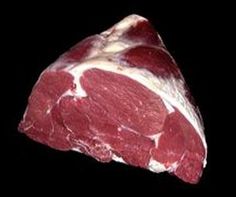 a piece of meat is shown on a black background