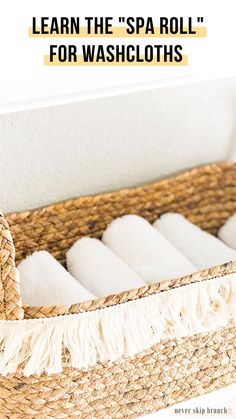 a basket with white towels in it and the words learn the spa roll for washcloths