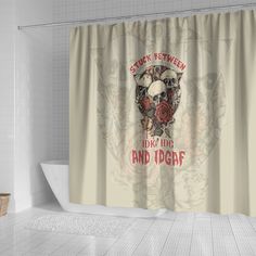 a shower curtain with an image of a bear and roses on it, hanging in a bathroom