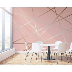 a dining room with pink walls and white chairs