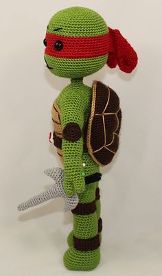 a crocheted stuffed toy with a turtle on it's back