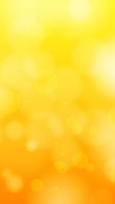 an orange and yellow blurry background with lots of small circles on the top right corner