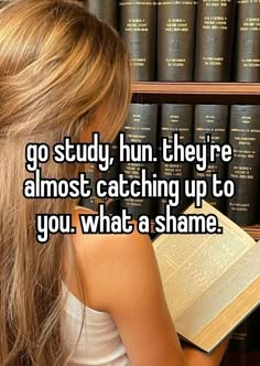 a woman reading a book in front of bookshelves with the words go study, they