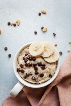 a bowl of oatmeal with bananas and chocolate chips