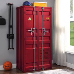 a tall red locker with two doors on the front and one door open to reveal a basketball