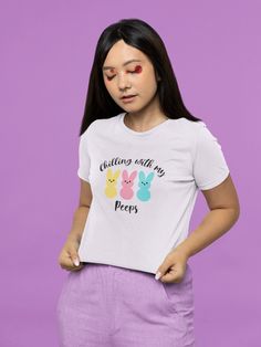 a woman wearing a white shirt with winnie the pooh and eenies on it