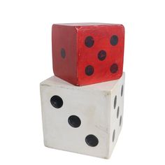 two red and one white dice stacked on top of each other