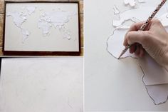 a person is making a world map out of cut paper with a pencil and crayons