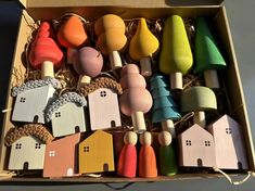 a box filled with lots of colorful wooden toys