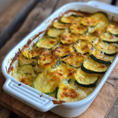 a casserole dish with zucchini and cheese