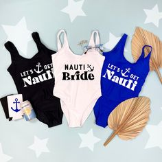 three women's swimsuits with the words nauti and nauti on them