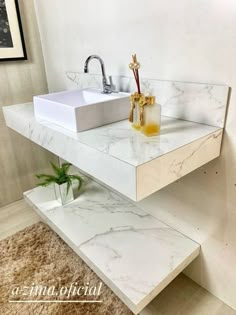 a white sink sitting on top of a counter in a bathroom