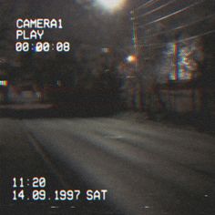 a blurry image of a street at night with the camera on it's side