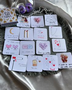 playing cards are laid out on a tray with beads and other items around them, including an ornament