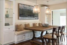 a dining room table with chairs and benches