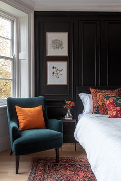 a bed room with a neatly made bed and a blue chair next to it on top of a wooden floor