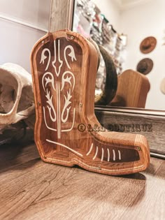 a carved wooden object sitting on top of a table