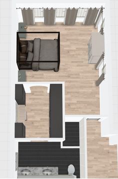 an overhead view of a living room and kitchen in a small apartment with wood flooring