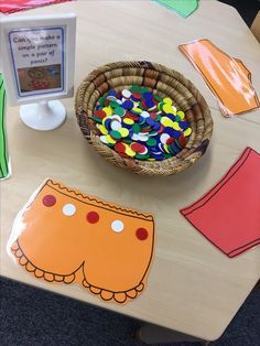 a wooden table topped with lots of crafting supplies