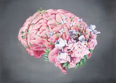 a large pink brain with flowers on it's side and the top part of its head