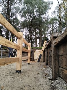 the fence is made out of wood and logs