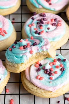 cookies with frosting and sprinkles on a cooling rack