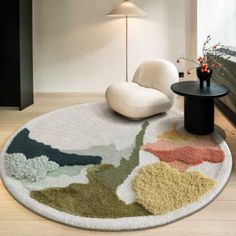 a living room area with a rug and chair in it, along with a lamp on the wall