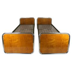 pair of mid century modern daybeds in wood and chrome