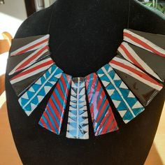 "This is a gorgeous bib-type necklace made in lightweight polymer clay (5.5 oz)  that displays nicely under a white or black blouse.   It is resin-sealed and strung on very high-strength black stringing wire, with a toggle closure for easy on/off.   Center bead is 3.5\".   Length - 20\"." Leather Bib Necklace, Unique Handmade Bib Necklace, Polymer Clay Bib Necklace, Unique Handmade Black Bib Necklaces, Black Polymer Clay Necklace, Bib Necklace, Wedding Jewellery Necklace, Black Blouse, Wedding Necklace