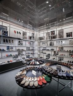 there are many pairs of shoes on display