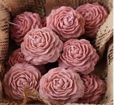 some pink flowers in a wicker basket