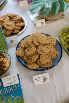 cookies and grapes are on the table for dessert