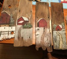 three pieces of wood painted with farm scenes