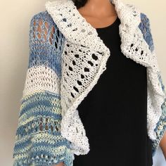 I Designed And Hand Knitted This Shrug, Sweater, Bolero, Shawl. Cotton Yarns In Ombr Blue And White And White Valance Trim. Wide 3/4 Sleeves. Solid And Lace Style Hand Knit. White Valance Trim Bottom And Top . Great Spring And Summer Shrug That Will Be The Focal Point Of Your Outfit On Dress Up Or Dress Down Days. Size : S/M Measures: 30” Arm Pit To Arm Pit Designed And Hand Knitted In Usa! White Hand Knitted Casual Cardigan, White Hand Knitted One Size Sweater, White Knitted Sweater For Spring, Casual White Knitting Pattern For Spring, White Casual Knitting Pattern, Casual White Knitting Pattern, Casual White Hand Knitted Sweater, Hand Knitted White Sweater One Size, White Crochet Sweater For Layering