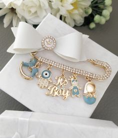 two personalized bracelets on top of a white napkin with flowers in the background