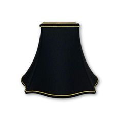 a black lamp shade with gold trim