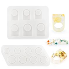 an assortment of rings and ice trays on a white background