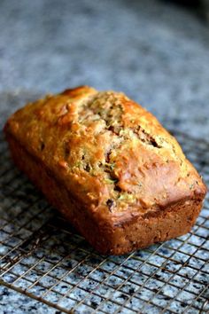 a loaf of bread sitting on top of a cooling rack