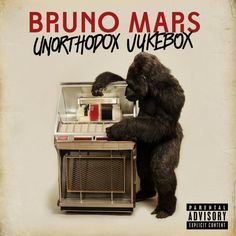 a big furry bear standing next to an old fashioned jukebox with the words bruno maps on it