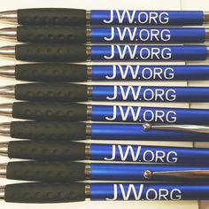 a bunch of pens that are sitting on top of each other with writing on them